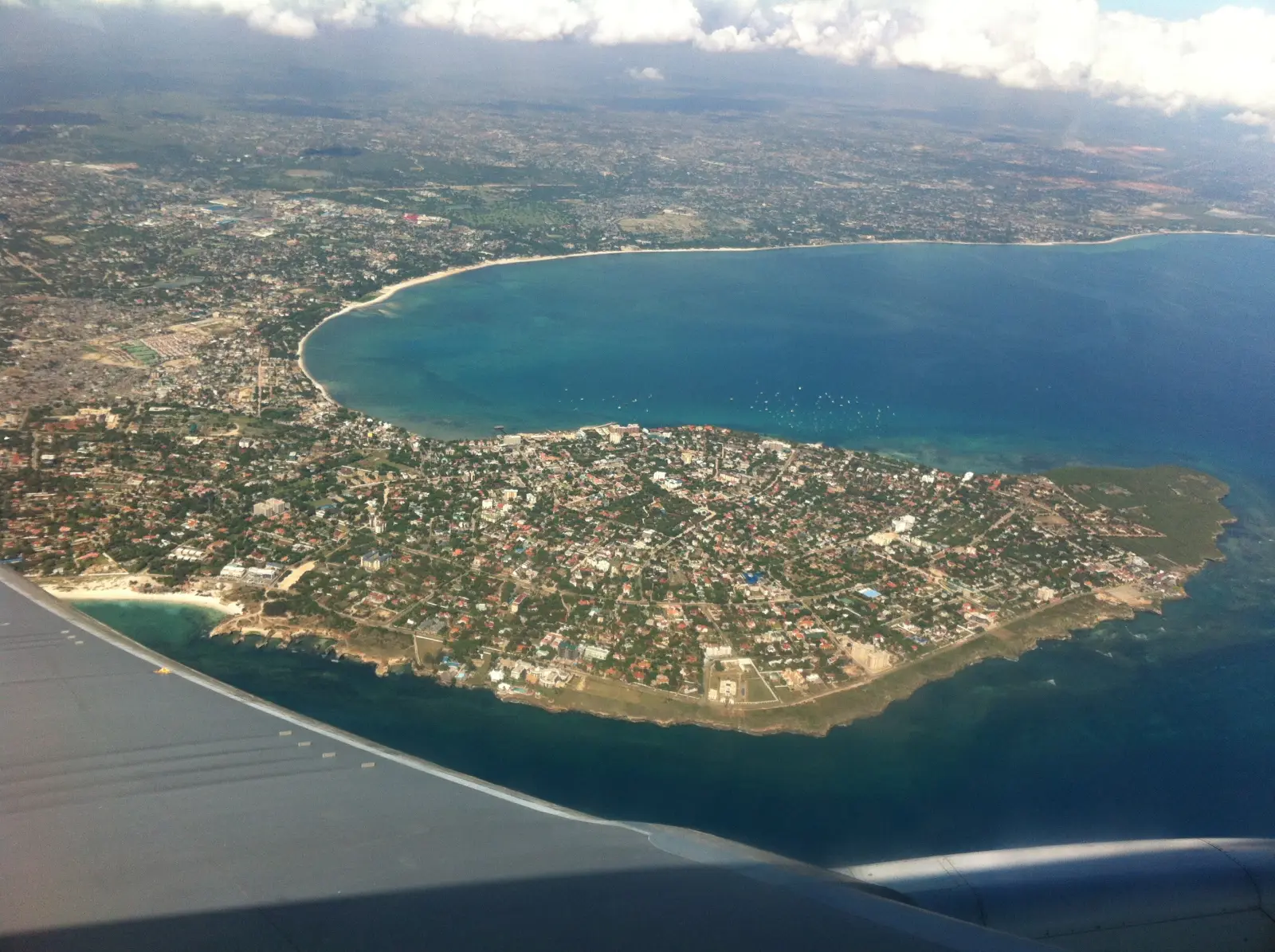 Aerial view of the Msasani Peninsula, curving into the turquoise Indian Ocean